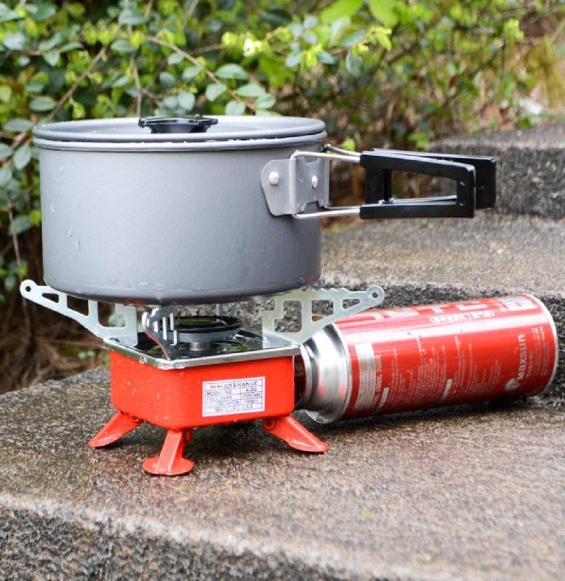 GENIYO Portable Gas Stove And Picnic Butane Gas Burner For Outdoor Camping, Hiking, Travelling, To Cooking The Food | Stainless Steel Cylinder, Folding Furnace, Camping Equipment, Gastove With Pouch