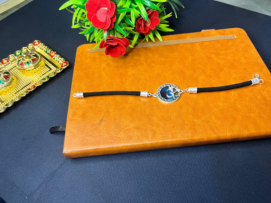 Thread of Faith – Minimal Om Rakhi in Stylish Black-Blue